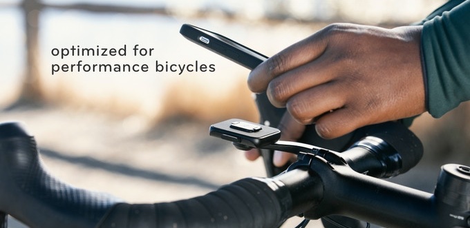 Picture of a hand placing attaching his phone to the Peak Design Out-Front Bike Mount